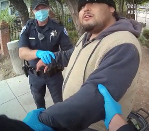 In this April 19, 2021, screenshot from Alameda Police body camera video, officers attempt to arrest Mario Gonzalez, who later died in custody, in Alameda, Calif.
