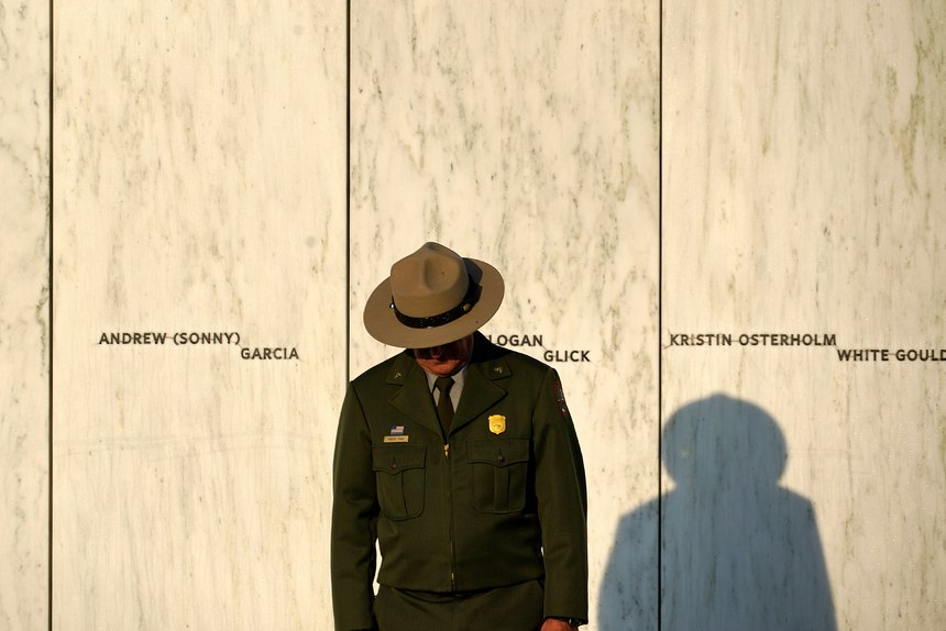A National Park Service ranger stands in front of the Wall of Names at the Flight 93 National Memorial in Shanksville, Pa. before a Service of Remembrance Saturday, Sept. 11, 2021, as the nation marks the 20th anniversary of the Sept. 11, 2001 attacks.