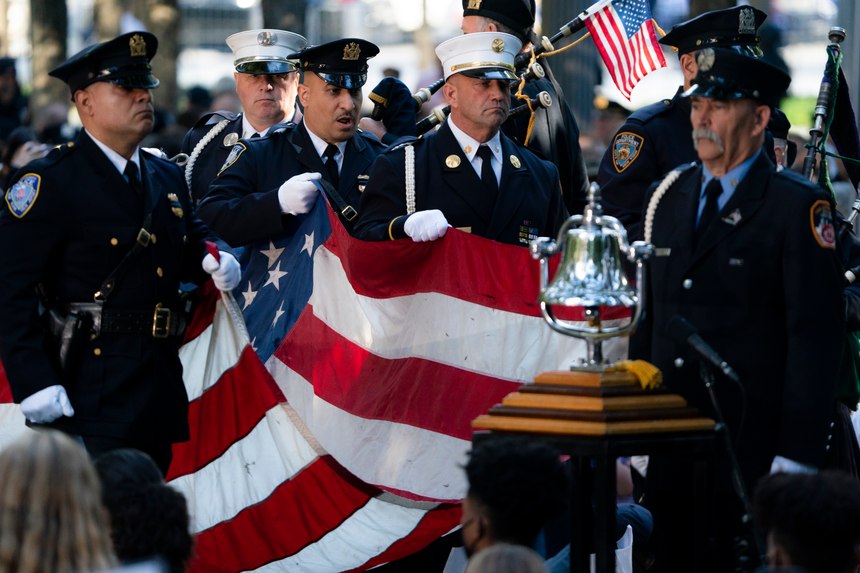 A memorial flag is brought onto the stage during ceremonies to commemorate the 20th anniversary of the Sept. 11 terrorist attacks, Saturday, Sept. 11, 2021, at the National September 11 Memorial & Museum in New York.