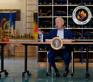 President Joe Biden greets firefighters as he tours the National Interagency Fire Center, Monday, Sept. 13, 2021, in Boise, Idaho.