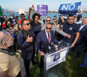 James Craig, a former Detroit Police Chief, announces he is a Republican candidate for Governor of Michigan amongst protesters on Belle Isle in Detroit, Tuesday, Sept. 14, 2021.