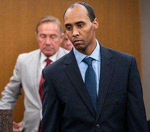 In this June 7, 2019 file photo, former Minneapolis police officer Mohamed Noor walks to the podium to be sentenced at Hennepin County District Court in Minneapolis.