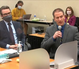 In this April 15, 2021, file image taken from video, defense attorney Eric Nelson, left, and defendant, former Minneapolis police officer Derek Chauvin, address Hennepin County Judge Peter Cahill at the Hennepin County Courthouse in Minneapolis.
