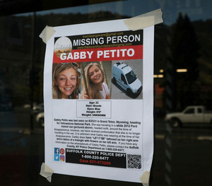 This Thursday, Sept. 16, 2021, photo, shows a Suffolk County Police Department missing person poster for Gabby Petito posted in Jakson, Wyo. Petito, 22, vanished while on a cross-country trip in a converted camper van with her boyfriend.