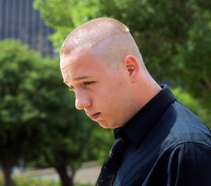 In this Wednesday, June 13, 2018, file photo, Shane Gaskill, of Wichita, Kan., leaves federal court in Wichita. Gaskill, a gamer whose online dispute with another player sparked a deadly hoax call, will have to face a jury after violating the terms of a diversion deal he made with prosecutors, a judge ruled Monday, Sept. 20, 2021.