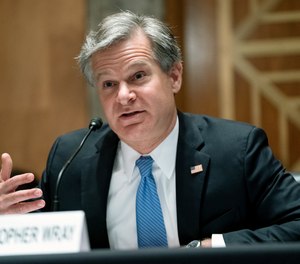 FBI Director Christopher Wray testifies before a Senate Homeland Security and Governmental Affairs Committee hearing to discuss security threats 20 years after the 9/11 terrorist attacks, Tuesday, Sept. 21, 2021 on Capitol Hill in Washington.