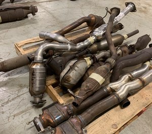 A file photo shows catalytic converters that were seized in an investigation. Thefts of the emission control devices have risen as prices for the precious metals they contain have jumped.