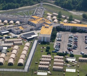 In this May 9, 2011, file photo, the Louisiana State Penitentiary at Angola is seen in West Feliciana Parish, La.