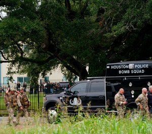 Police gather at YES Prep Southwest Secondary school after a shooting on Friday, Oct. 1, 2021 in Houston.