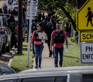 Police arrive at the scene of a shooting at a senior housing apartment on Friday, Oct. 8, 2021 in Capitol Heights, Md.