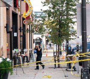 Investigators processed the chaotic scene of a multiple shooting at the bar Truck Park in St. Paul, Minn., that happened after midnight on Sunday, Oct. 10, 2021.