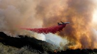 Calif. firefighters, aircraft try to box in growing wildfire