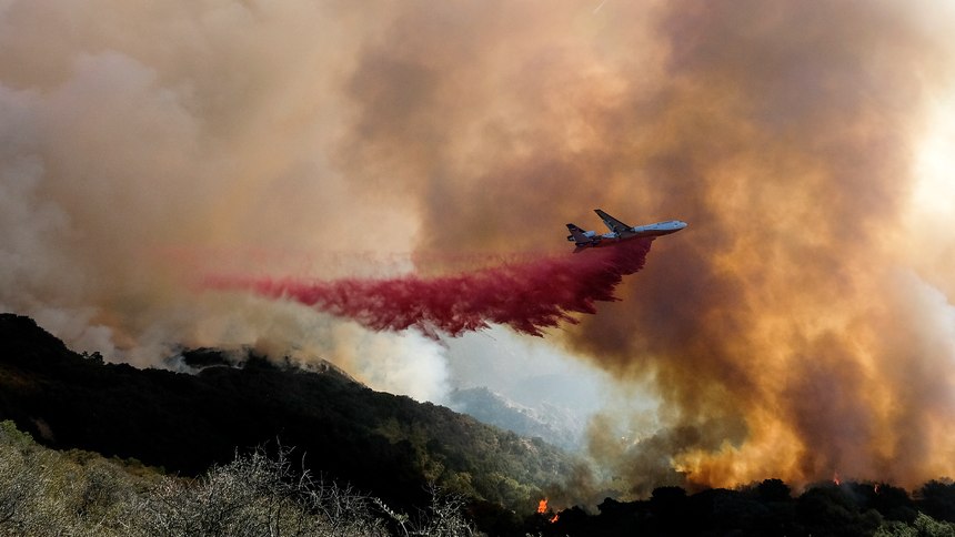 An air tanker drops retardant on flames scorching a hillside in Goleta, Calif. The Alisal Fire covered more than 22 square miles in the Santa Ynez Mountains west of Santa Barbara.