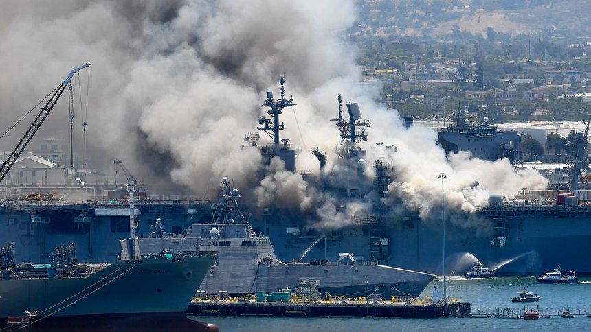 In this July 12, 2020, file photo, smoke rises from the USS Bonhomme Richard at Naval Base San Diego in San Diego, after an explosion and fire on board the ship at Naval Base San Diego.