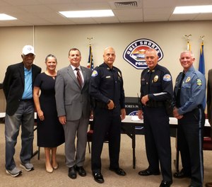 This photo released by the Gulf Shores Police Department shows actor Morgan Freeman, left, with six other members of a panel that interviewed police recruits in Gulf Shores, Ala., on Friday, Oct. 15, 2021.