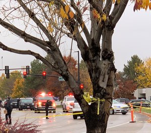 Police close off a street outside a shopping mall after a shooting in Boise, Idaho on Monday, Oct. 25, 2021. Police said there are reports of multiple injuries and one person is in custody.