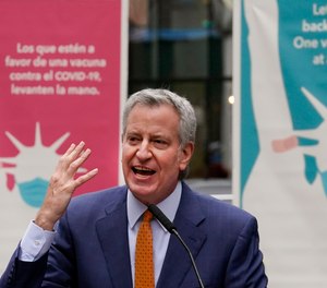 New York Mayor Bill de Blasio speaks at the opening of a Broadway COVID-19 vaccination site in Times Square, April 12, 2021, in New York.