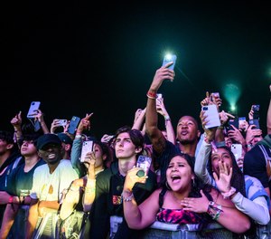 The crowd watches as Travis Scott performs at Astroworld Festival at NRG park on Friday, Nov. 5, 2021 in Houston. Several people died and numerous others were injured in what officials described as a surge of the crowd at the music festival while Scott was performing.