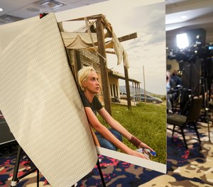 A photo of cinematographer Helyna Hutchins is displayed before a news conference to announce a lawsuit against Alec Baldwin and others involved in the death on the "Rust' film set.
