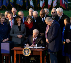 President Joe Biden signs the $1.2 trillion bipartisan infrastructure bill into law during a ceremony on the South Lawn of the White House on Nov. 15, 2021.