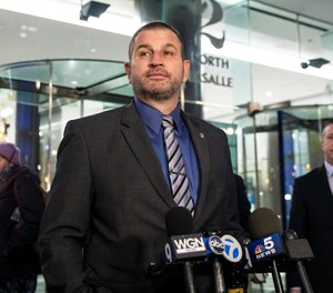 Fraternal Order of Police Lodge 7 President John Catanzara speaks to reporters as he walks out of a Chicago Police Board hearing in the Loop, Monday, Nov. 15, 2021, in Chicago. Catanzara said Monday he'll retire from the force amid a disciplinary hearing that could have ended with his firing.