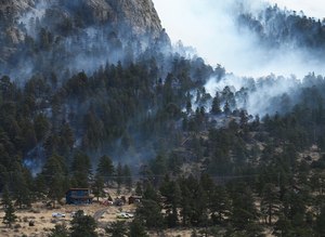 The Kruger Rock fire was burning in Estes Park, Colo., on Nov. 16. Work for the State Wildland Inmate Fire Team includes clearing dead or dying trees and fighting wildfires.