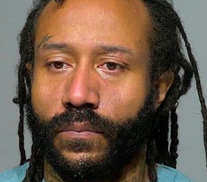 This Nov. 3, 2021 photo provided by the Milwaukee County Sheriff's Office shows Darrell Brooks. Investigators are looking into whether the SUV driver who plowed through a Christmas parade in suburban Milwaukee, killing and injuring several people, was fleeing a crime, a law enforcement official told The Associated Press.
