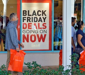 Shoppers look for Black Friday deals at the Ellenton Premium Outlet stores Friday, Nov. 27, 2020, in Ellenton, Fla.