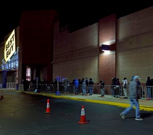People line up for a Black Friday sale at a Best Buy store, Friday, Nov. 26, 2021.