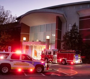 Emergency vehicles congregate around the entrance to Belk at Southpoint Mall in Durham, N.C. after three people, including a 10-year-old, were wounded in an afternoon shooting on Black Friday, Nov. 26, 2021.