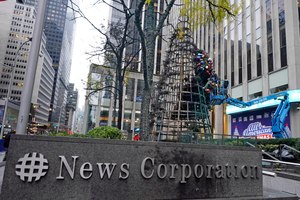 The tree had been ceremonially lit during a network Christmas special on Sunday. Its charred remains were being dismantled Wednesday.