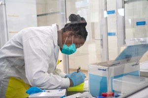 Medical scientist Melva Mlambo, works in sequencing COVID-19 omicron samples at the Ndlovu Research Center in Elandsdoorn, South Africa on Wednesday. The centrer is part of the Network for Genomic Surveillance in South Africa, which discovered the omicron variant.