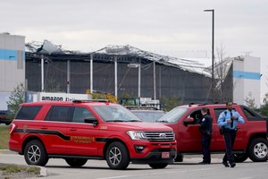 A heavily damaged Amazon fulfillment center is seen Saturday, Dec. 11, 2021, in Edwardsville, Ill. A large section of the roof of the building was ripped off and walls collapsed when strong storms moved through area Friday night.