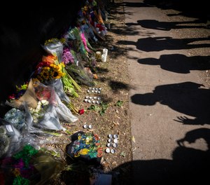 Visitors cast shadows at a memorial to the victims of the Astroworld concert in Houston on Nov. 7.