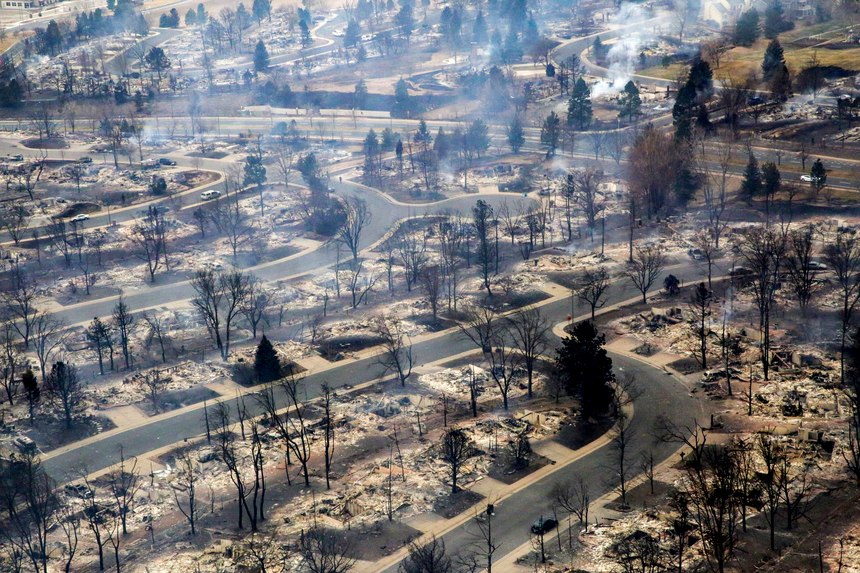 A view of a Boulder County neighborhood that was destroyed by a wildfire is seen from a Colorado National Guard helicopter during a flyover by Gov. Jared Polis on Friday, Dec. 31, 2021. Tens of thousands of Coloradans driven from their neighborhoods by a wind-whipped wildfire anxiously waited to learn what was left standing of their lives Friday as authorities reported more than 500 homes were feared destroyed. 