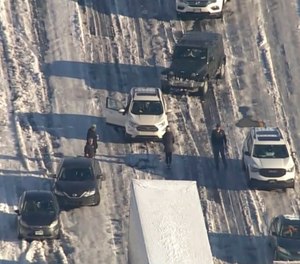 Motorists sit stranded on Interstate 95 near Fredericksburg, Va, on Tuesday, Jan. 4, 2022.