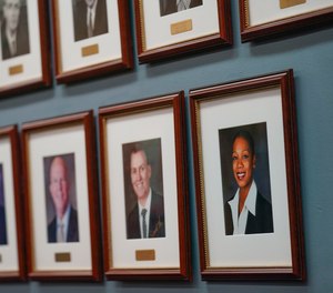 A portrait of Police Commissioner Keechant Sewell, bottom right, is displayed with the photos of previous NYPD commissioners at police headquarters in New York, Monday, Jan. 3, 2022.