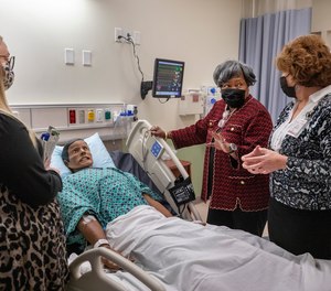 Polly Sheppard, center, visits the Trident Technical College Nursing School simulation lab Monday, Dec. 13, 2021, in North Charleston, S.C. with nursing student Niki Walker, left, and Nursing School Dean Karen Rogers.