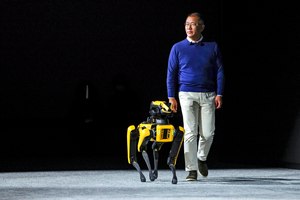 Euisun Chung, chairman of Hyundai Motor Group, takes the stage with the robot Spot from Boston Dynamics during the CES tech show on Jan. 4 in Las Vegas. 