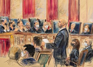 This artist's sketch depicts lawyer Scott Keller standing to argue on behalf of more than two dozen business groups seeking an immediate order from the Supreme Court to halt a Biden administration order to impose a vaccine-or-testing requirement on the nation's large employers during the COVID-19 pandemic, at the Supreme Court in Washington on Jan. 7.