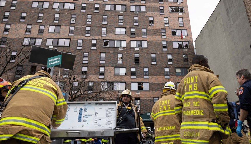 Firefighters work at the scene of a fatal fire at an apartment building in the Bronx on Sunday, Jan. 9, 2022, in New York. The majority of victims were suffering from severe smoke inhalation, FDNY Commissioner Daniel Nigro said. 