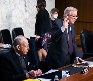Senate Judiciary Committee Chairman Sen. Dick Durbin, D-Ill., with ranking member Sen. Chuck Grassley, R-Iowa, left, during the committee hearing to examine the domestic terrorism threat one year after January 6, on Capitol Hill, Thursday, Feb. 10, 2022, in Washington.