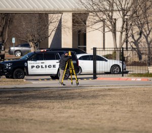 Law enforcement process the scene in front of the Congregation Beth Israel synagogue, Sunday, Jan. 16, 2022, in Colleyville, Texas. A man held hostages for more than 10 hours Saturday inside the temple. The hostages were able to escape and the hostage taker was killed. FBI Special Agent in Charge Matt DeSarno said a team would investigate