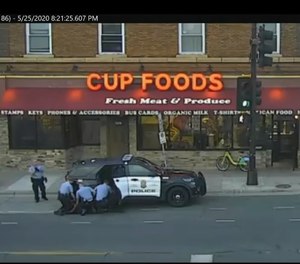 In this May 25, 2020 file image from surveillance video, Minneapolis police Officers from left, Tou Thao, Derek Chauvin, J. Alexander Kueng and Thomas Lane are seen attempting to take George Floyd into custody in Minneapolis, Minn.