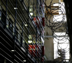 Barbed wire is seen inside the east block of death row at San Quentin State Prison Tuesday, Aug. 16, 2016, in San Quentin, Calif.