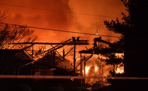 A structure fire burns at the Weaver Fertilizer Plant on Monday in Winston-Salem, N.C.