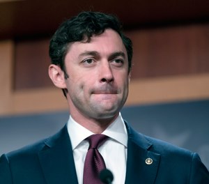 Sen. Jon Ossoff, D-Ga., takes a question from a reporter during a news conference on Capitol Hill in Washington, Sept. 28, 2021.