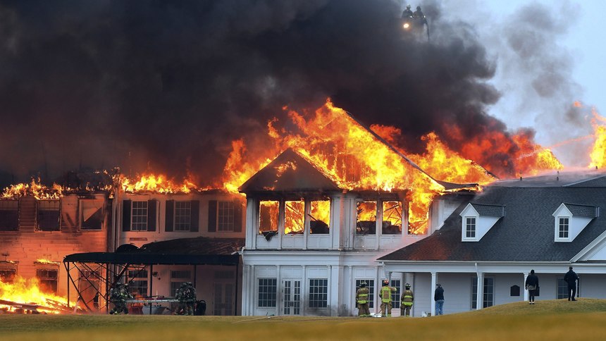 A fire burns at the main building at Oakland Hills Country Club in Bloomfield Township, Mich., on Thursday, Feb. 17, 2022. Firefighters battled a blaze at a more than century-old country club Thursday in suburban Detroit that's hosted several major golf tournaments and is one of Michigan’s most exclusive golf clubs.