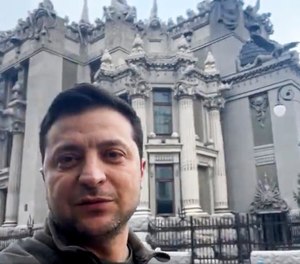 Ukrainian President Volodymyr Zelenskyy speaks to the nation via his phone in the center of Kyiv, Ukraine, on Saturday, Feb. 26, 2022. The country's president refused an American offer to evacuate, insisting that he would stay. 
