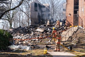 Firefighters worked the scene after an explosion and fire caused an apartment building to collapse in Silver Spring, Md., on March, 3.